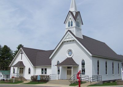 Metal Shingle Roof on a Beautiful White Church with Steeple