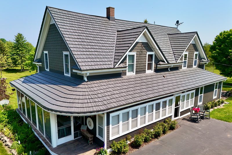 Brown house with rustic metal shingle roof